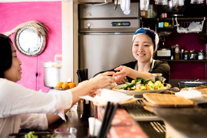 paying the bill over the counter at a restaurant in Japan