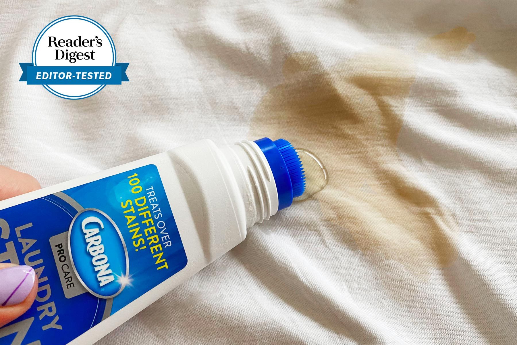 Carbona Stain Remover being used on a stained white sheet with the Reader's digest editor tested logo