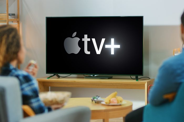 couple watching apple tv plus in living room