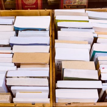 Stacks of books in boxes for donation