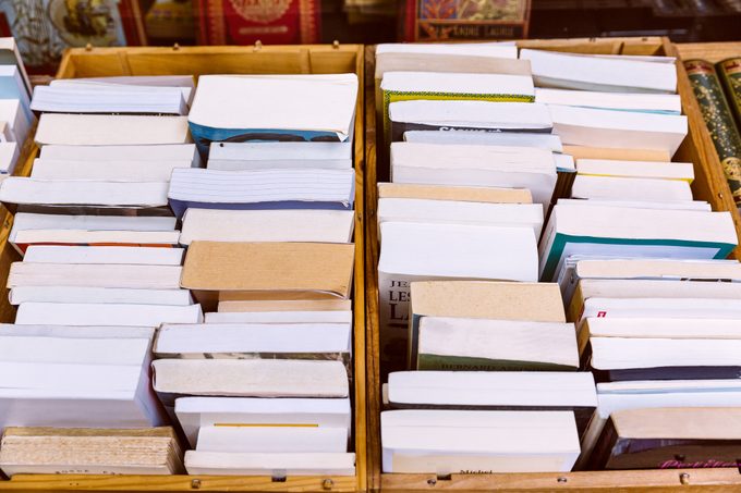 Stacks of books in boxes for donation