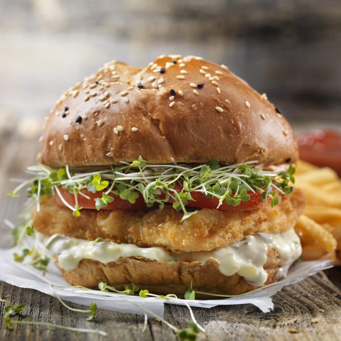 Crispy Fish Burger with Tarter Sauce, Lettuce, Tomato on a Brioche Bun