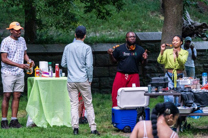 group of people celebrating Juneteenth by cooking outside