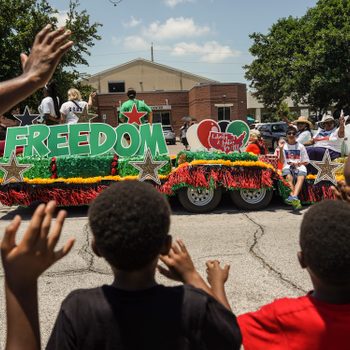 GALVESTON, TX - JUNE 19: Spectators watch Juneteenth Parade commemorating the end of slavery in the United States on June 19, 2021 in Galveston, Texas