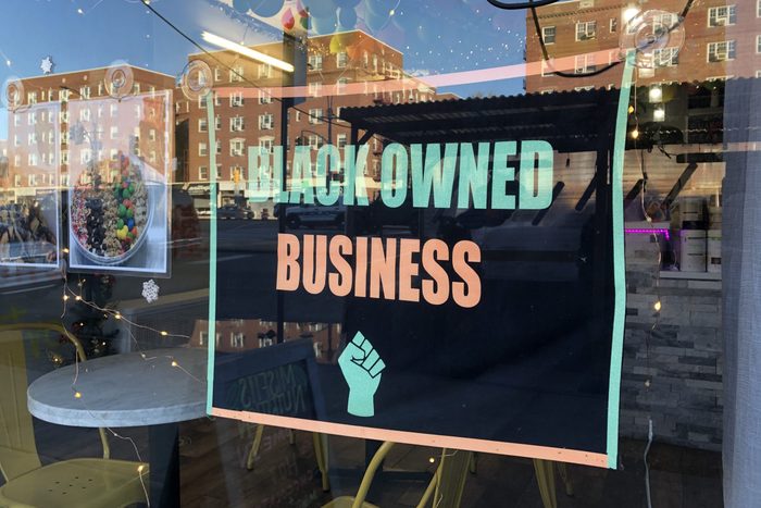 Black Owned Business sign in local storefront window, MisFits Nutrition, Queens, New York