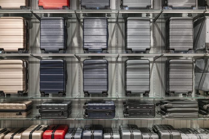 Suitcases on the shelves in the supermarket
