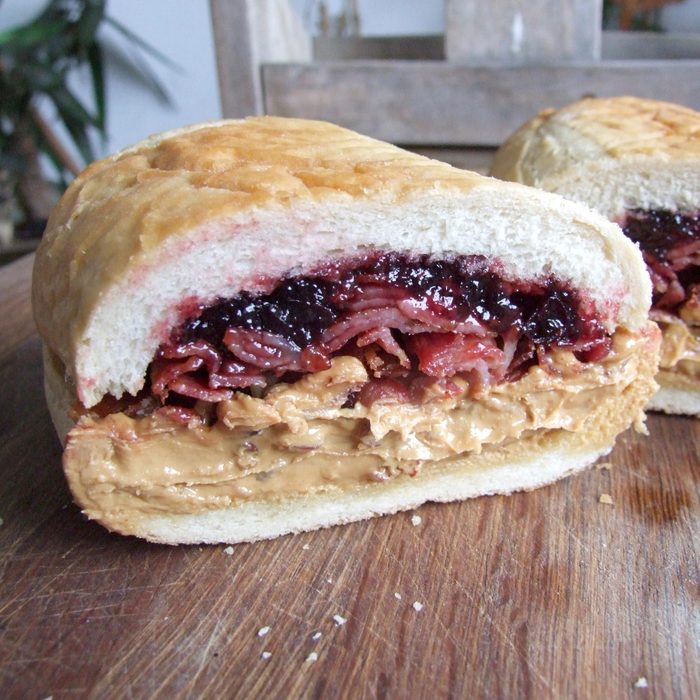 fools gold sandwich made with bacon, peanut butter and jelly on bread