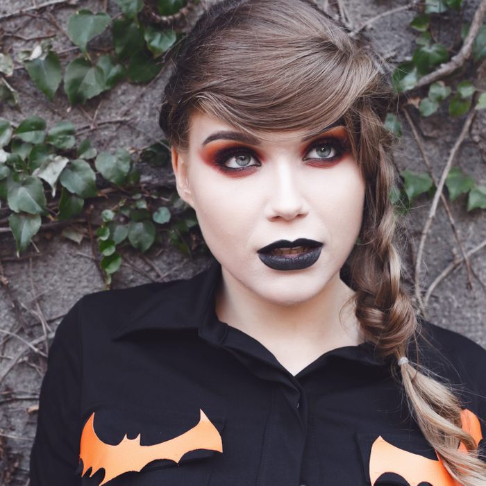 Smiling girl with halloween make up