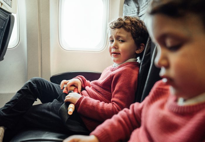 Brothers on an airplane