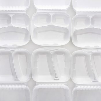 styrofoam food containers lined up against a white background