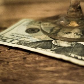 20 Dollar bill under a glass