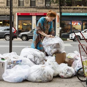 Anna Sacks looking through trash