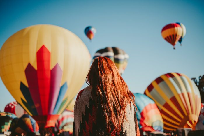 Woman watching hot air balloons