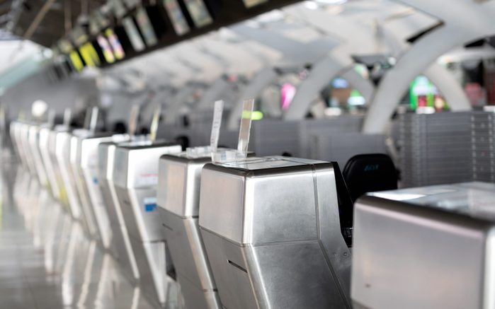 No people checking Passport Of Passenger At Counter In Airport.