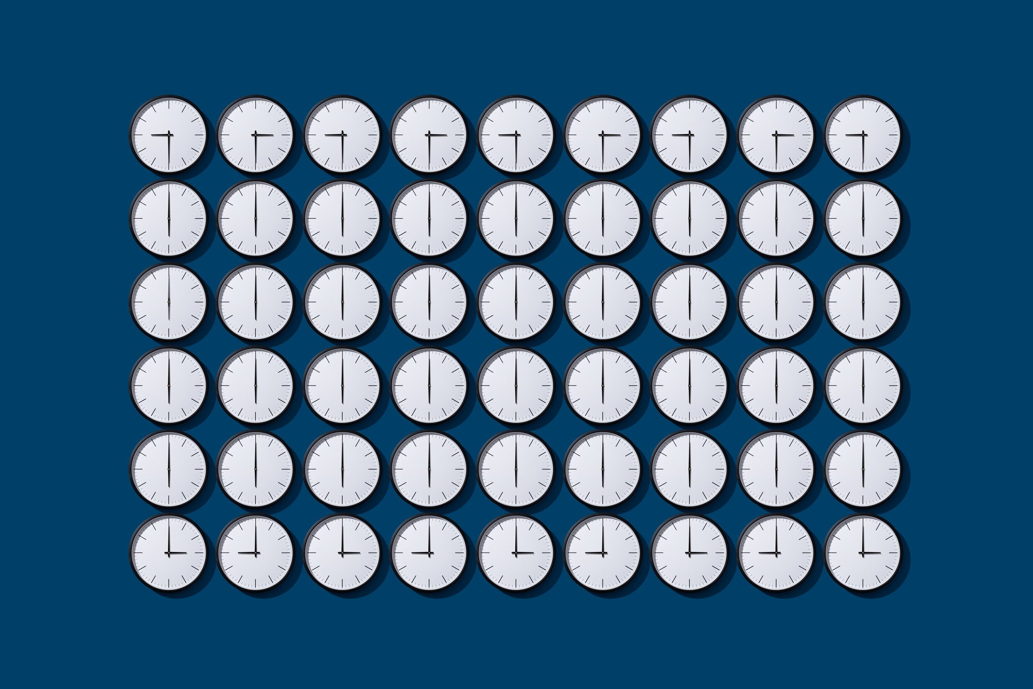 grid of clocks with arranged Clock Hands that create a grid