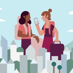 Two Girlfriends Look At Digital Nomad Visa While Traveling In Cityscape Together