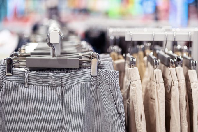 trousers or pants on rack in retail store
