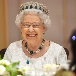 Queen Elizabeth sitting down for dinner