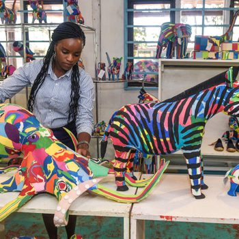 Grace Wangare, executive accountant, displays a finished toy octopus made from pieces of discarded flip-flops, at the Ocean Sole flip- flop recycling company shop in Nairobi, Kenya on February 09, 2022.