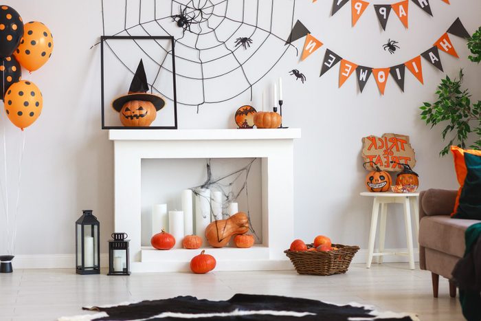 interior of house decorated for Halloween pumpkins, webs and spiders