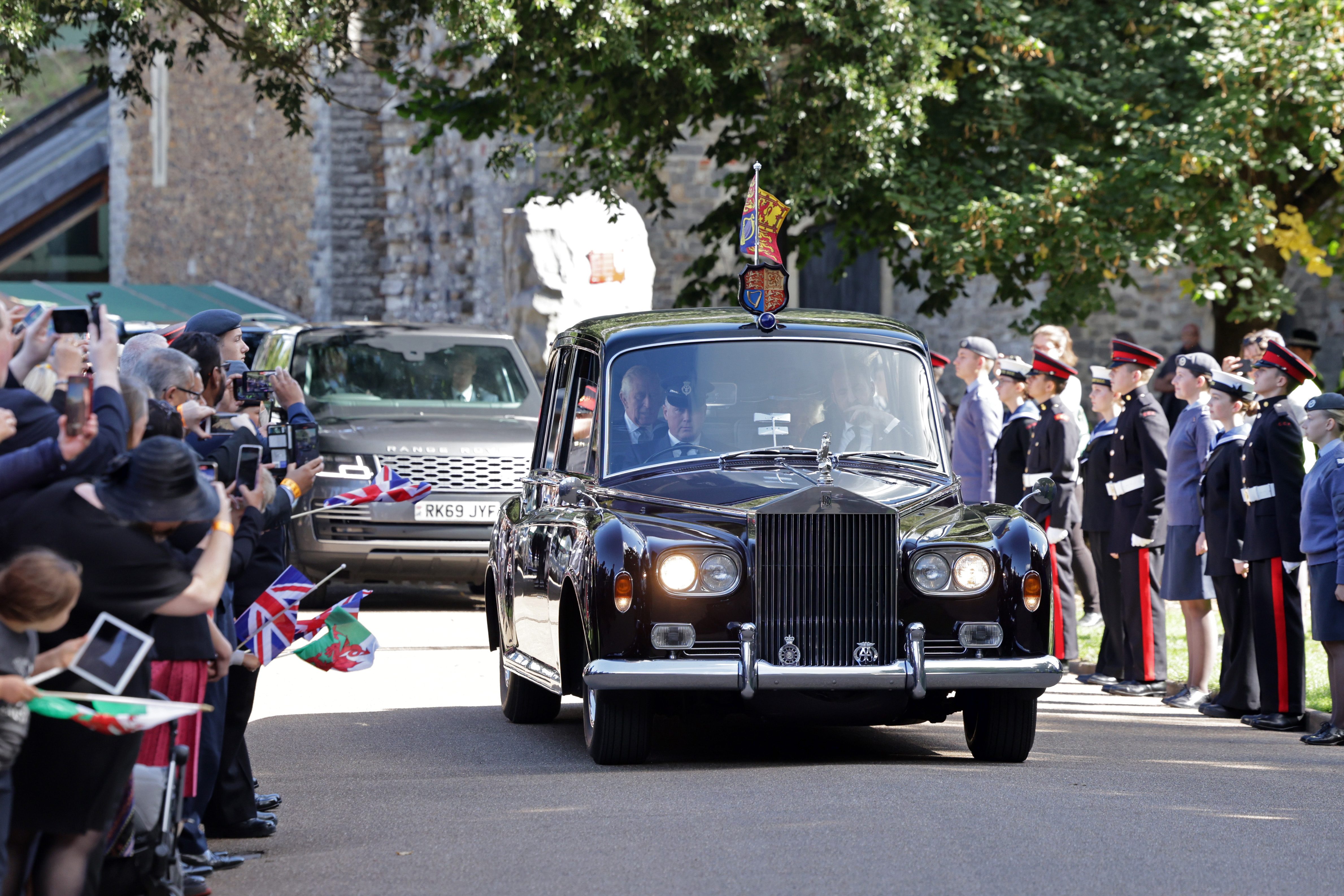 CARDIFF, WALES - SEPTEMBER 16: The car carrying King Charles III and Camilla, Queen Consort arrives at Cardiff Castle to conduct audiences on September 16, 2022 in Cardiff, Wales. King Charles III is visiting Wales for the first time since ascending the throne following the death of his mother, Queen Elizabeth II, who died at Balmoral Castle on September 8, 2022. (Photo by Chris Jackson/Getty Images)