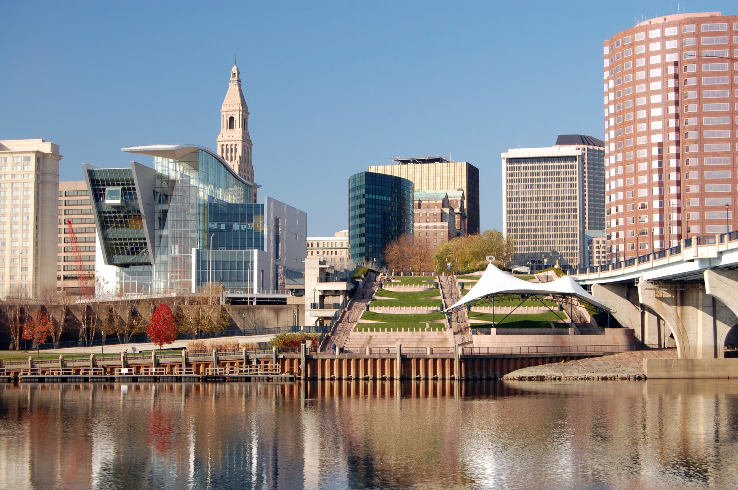 Hartford, Connecticut skyline on an autumn day. Connecticut River in the foreground.