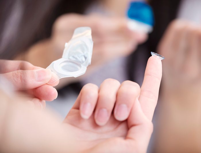close up of the hand of a Japanese Woman With Contact Lens