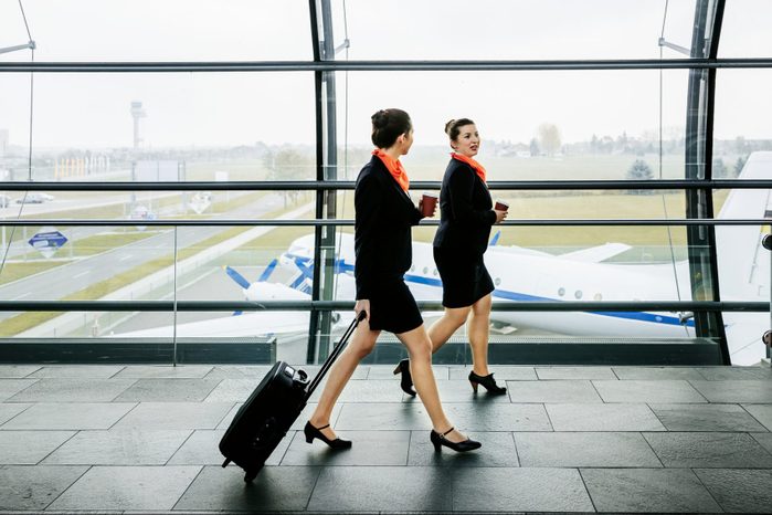 Two flight attendants on the way to their plane