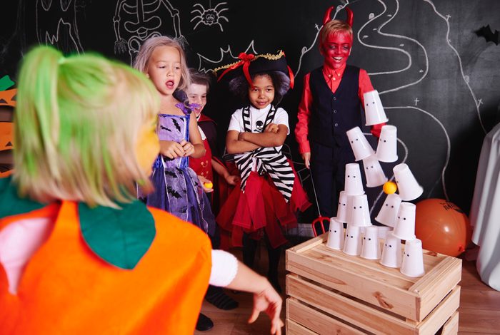 Kids taking part in halloween party games
