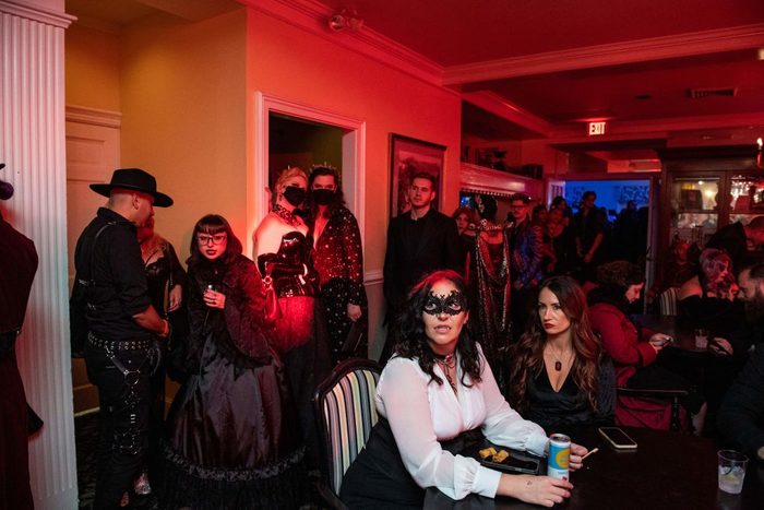 People in vampire costumes fill a lounge at the Endless Night Salem Vampire Ball in Salem, Massachusetts