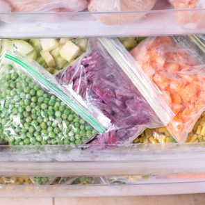 Assortment of frozen Vegetables in fridge. Frozen food in the freezer
