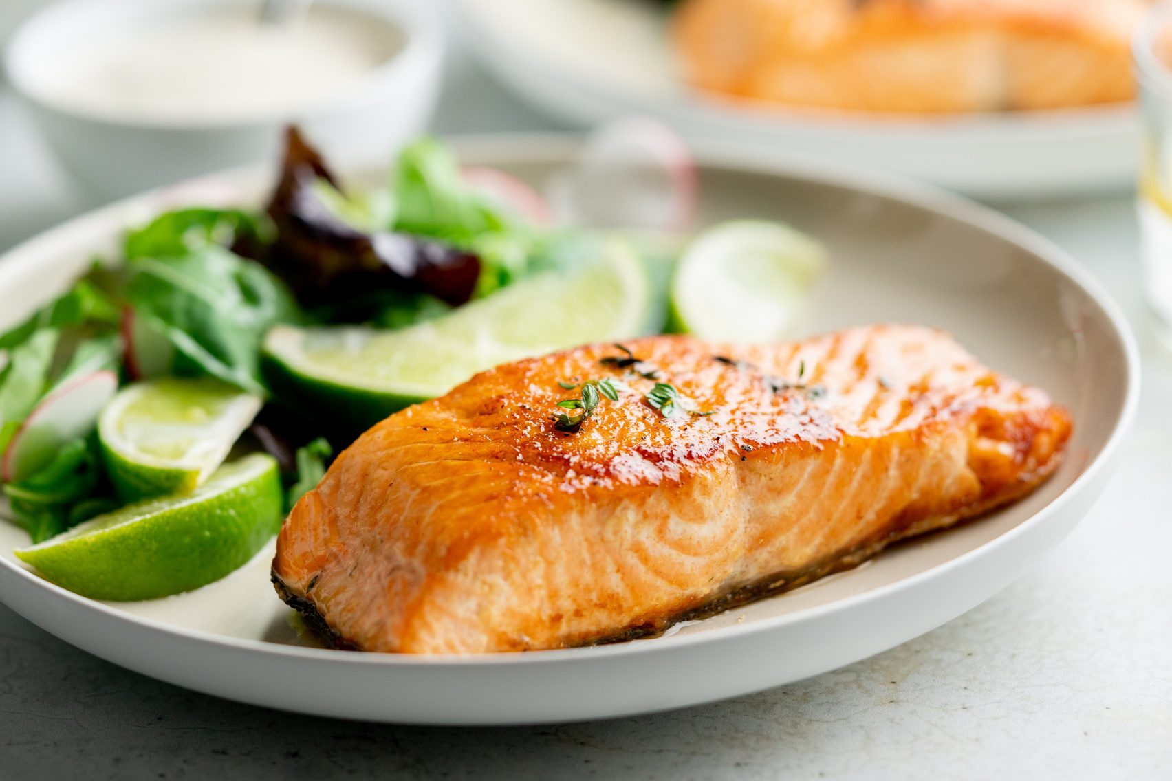 Grilled salmon fillet and fresh vegetable salad. Mediterranean diet.