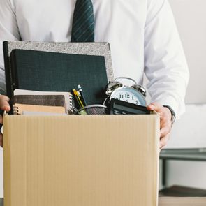 businessmen holding boxes for personal belongings