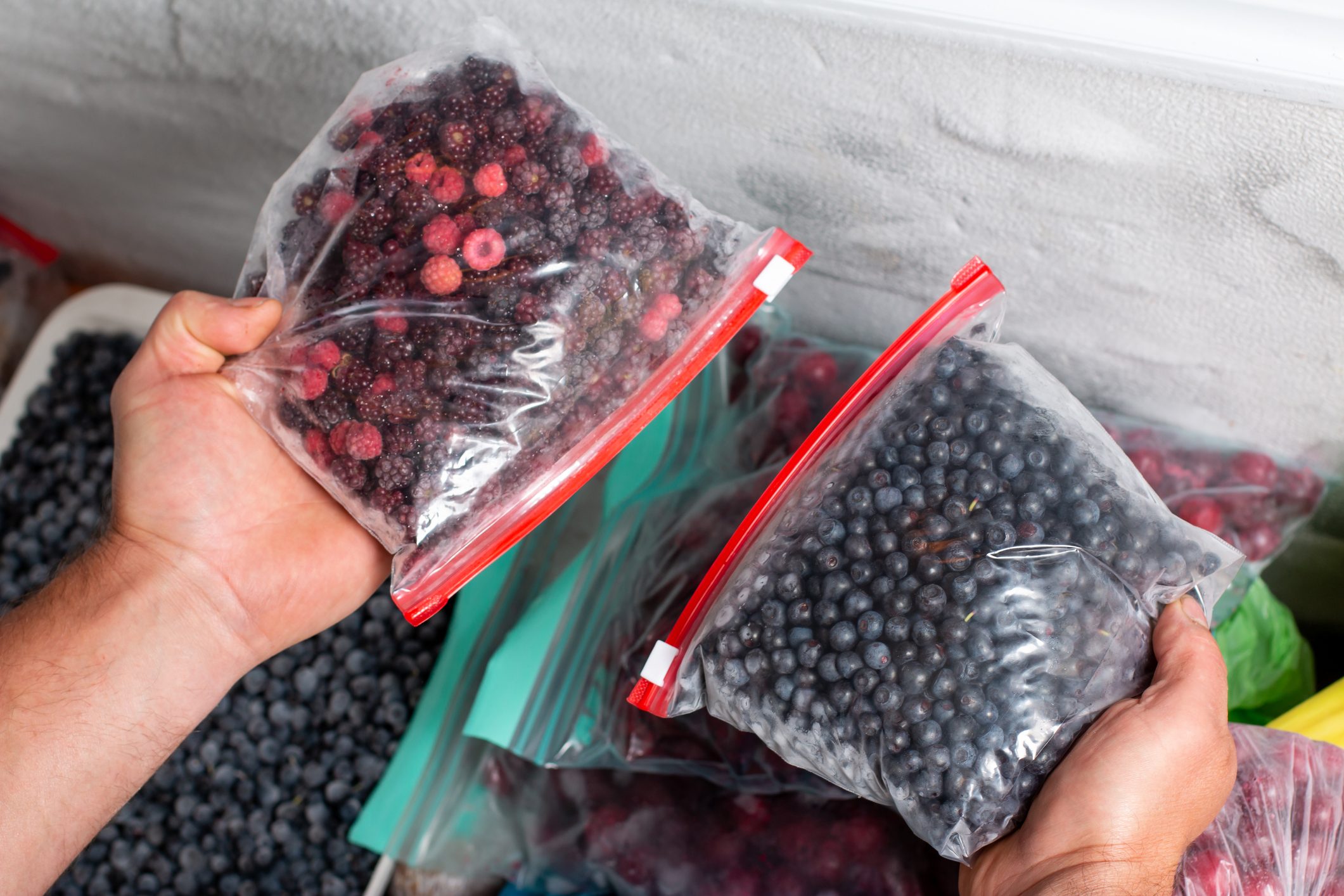Frozen berries in the freezer. Frozen mixed fruits and berries