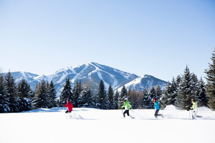 A family Snowshoeing in Sun Valley on a sunny winter day.