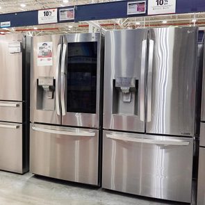 a row of refrigerators for sale at Lowe's