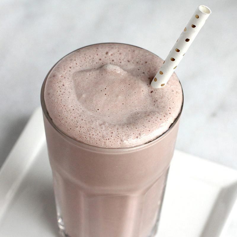 Frosty on a white plate with a straw