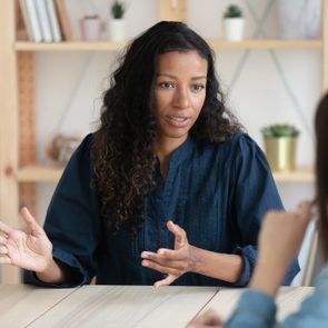 Close up confident african american businesswoman explaining new responsibilities.