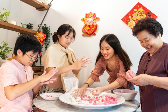 Making rice dumpling together on Chinese New Year