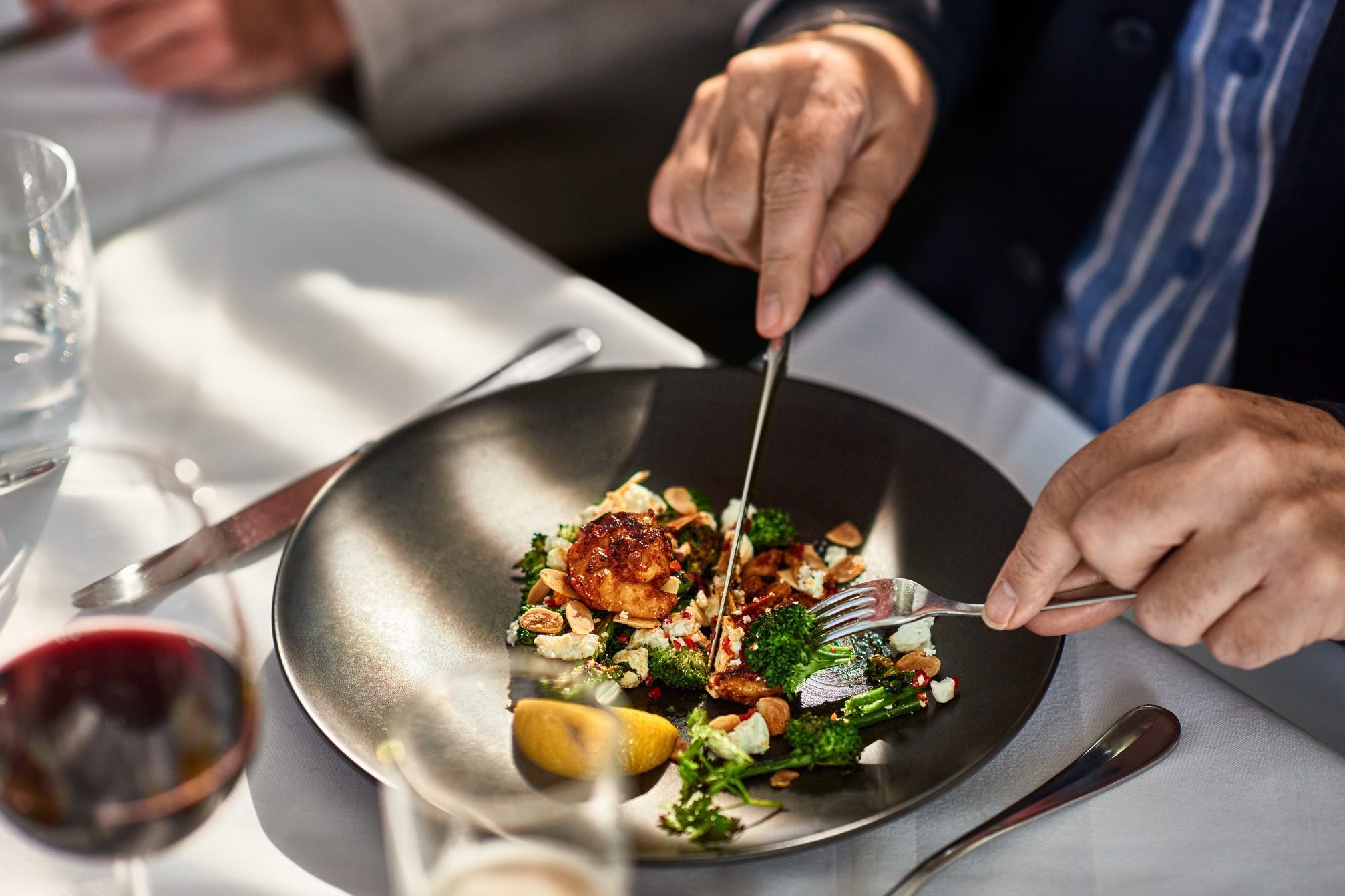 Man eating freshly prepared meal in restaurant