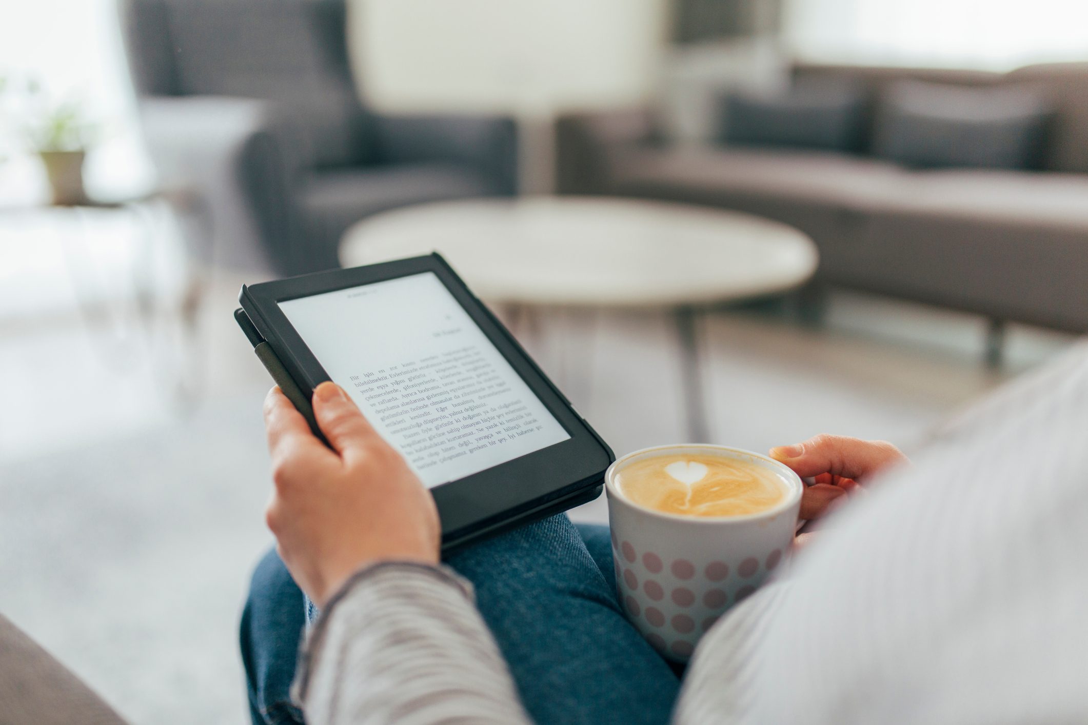 Woman Reading E-Book at Home