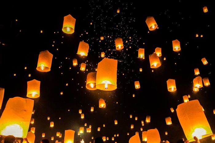 Low Angle View Of Illuminated Lanterns In City At Night