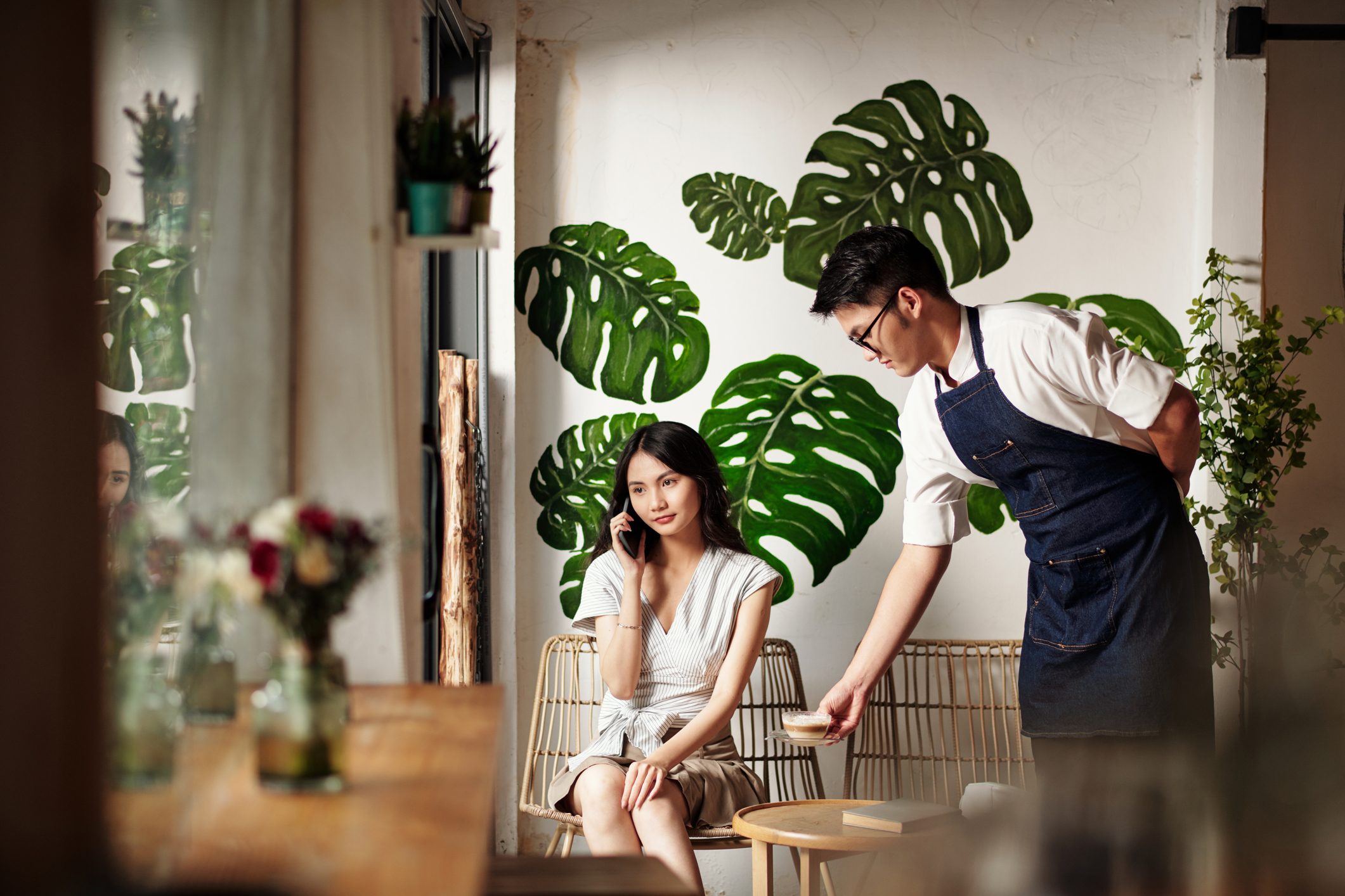 Waiter Bringing Coffee to Young Woman