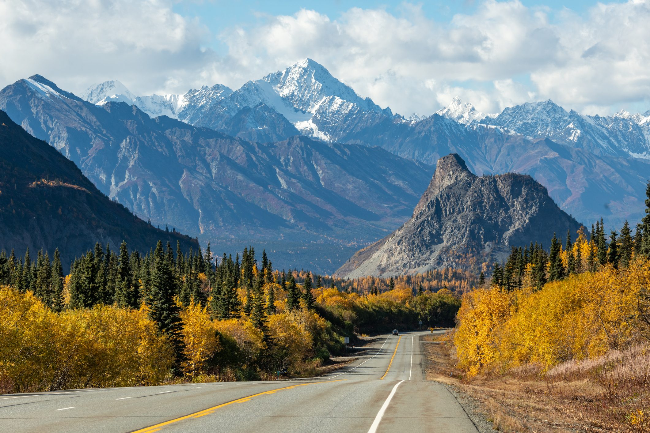 Lion Head Rock Formation on Glenn Highway scenic highway in Alaska with snow capped mountains