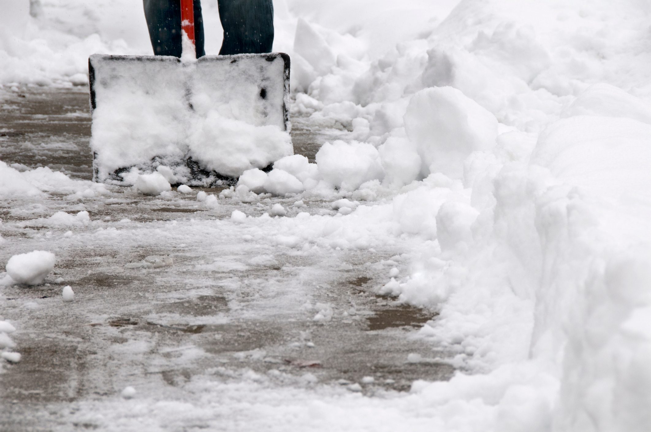 Shoveling Snow from Sidewalk
