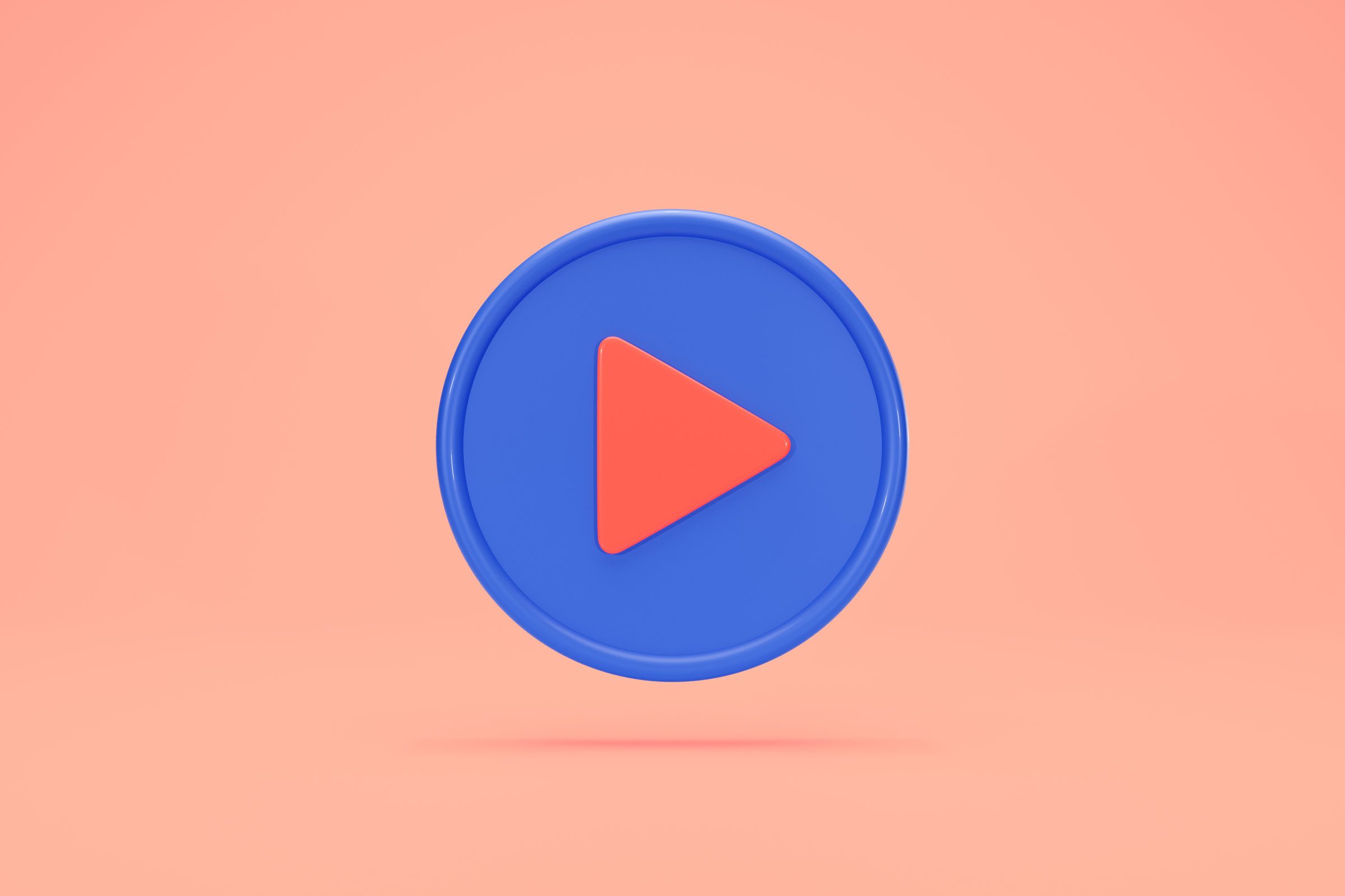 video play button floating on peach background