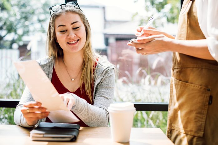 Woman ordering food at the restaurant