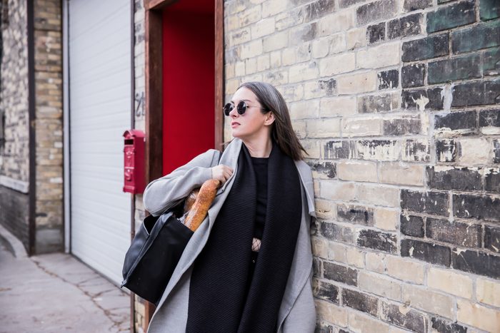 Woman exiting a building