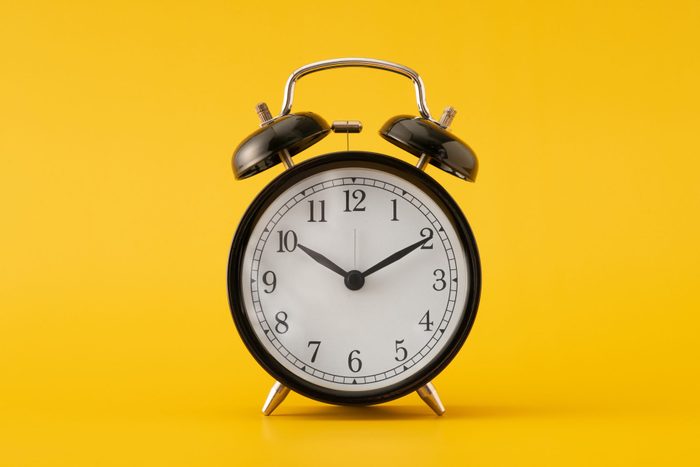 Clock on yellow background