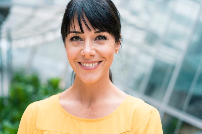 Confident smiling female entrepreneur